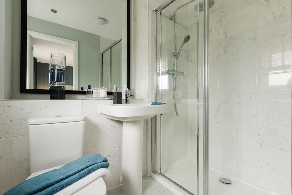 En-suite shower room away from the family
