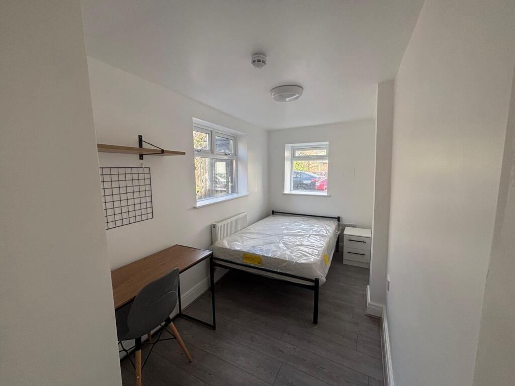 Bright and spacious double bedroom featuring la...