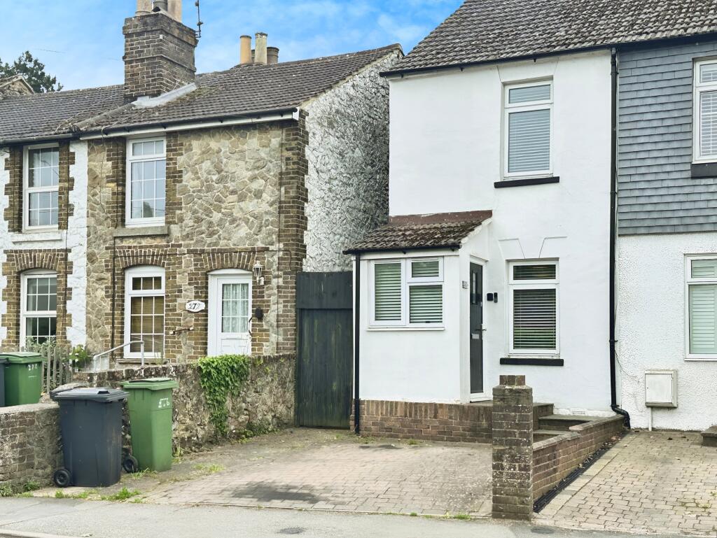 Front View Of The Property With Driveway Parking
