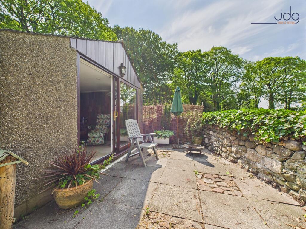 Converted Garage with sliding doors and seating area