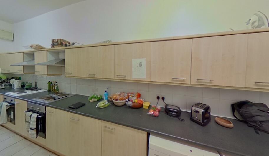 A modern kitchen featuring ample cabinetry and ...