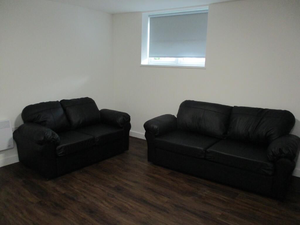A modern living room featuring two comfortable ...