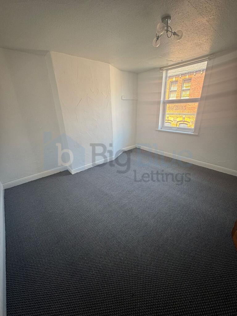 A bright and inviting double bedroom featuring ...