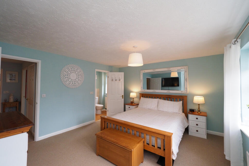 Large Master with built in wardrobe and en suite.