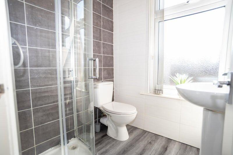Bright and modern bathroom featuring a spacious...