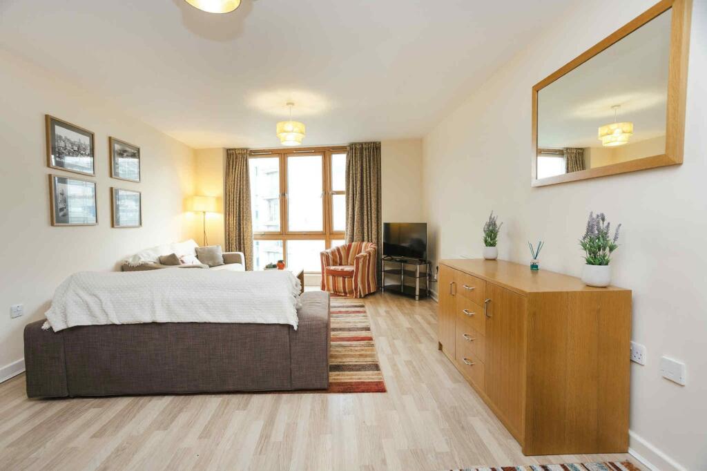 Bright and inviting living room featuring a com...