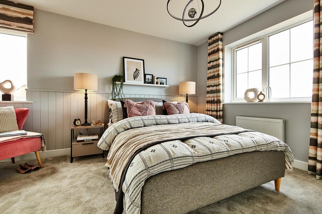 Bedroom 1 is flooded with natural light