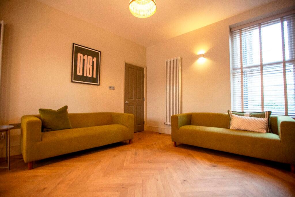 A spacious and inviting modern living room feat...