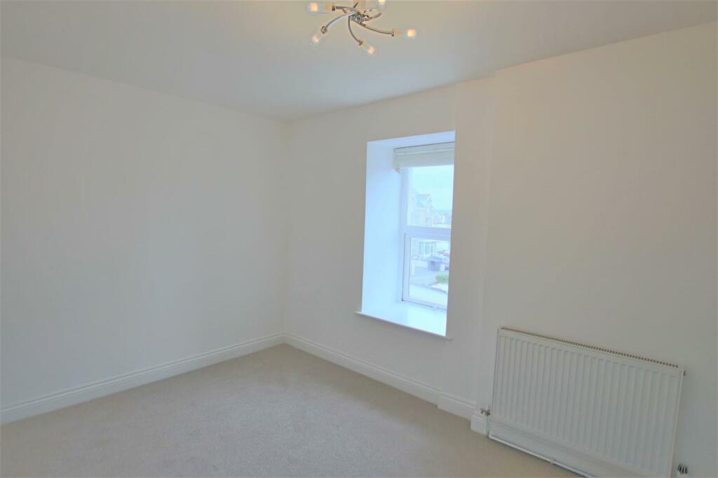 Flat 5. 10-12 Tolcarne Road Bedroom One.JPG