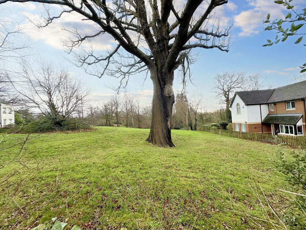 Green sward opposite property