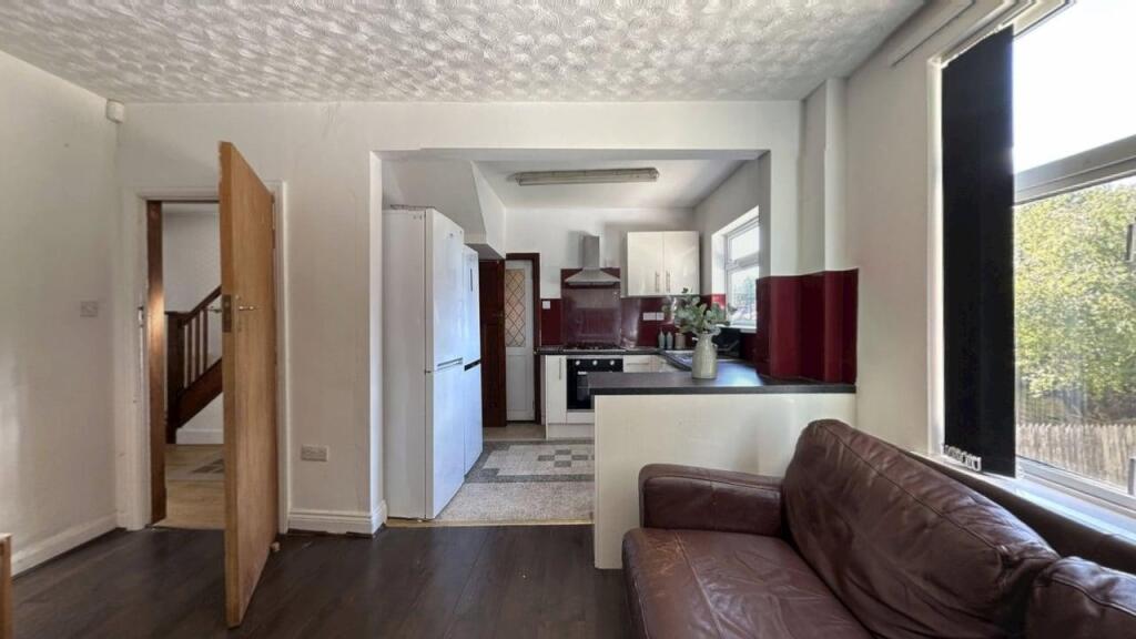 A bright and inviting living room with large wi...