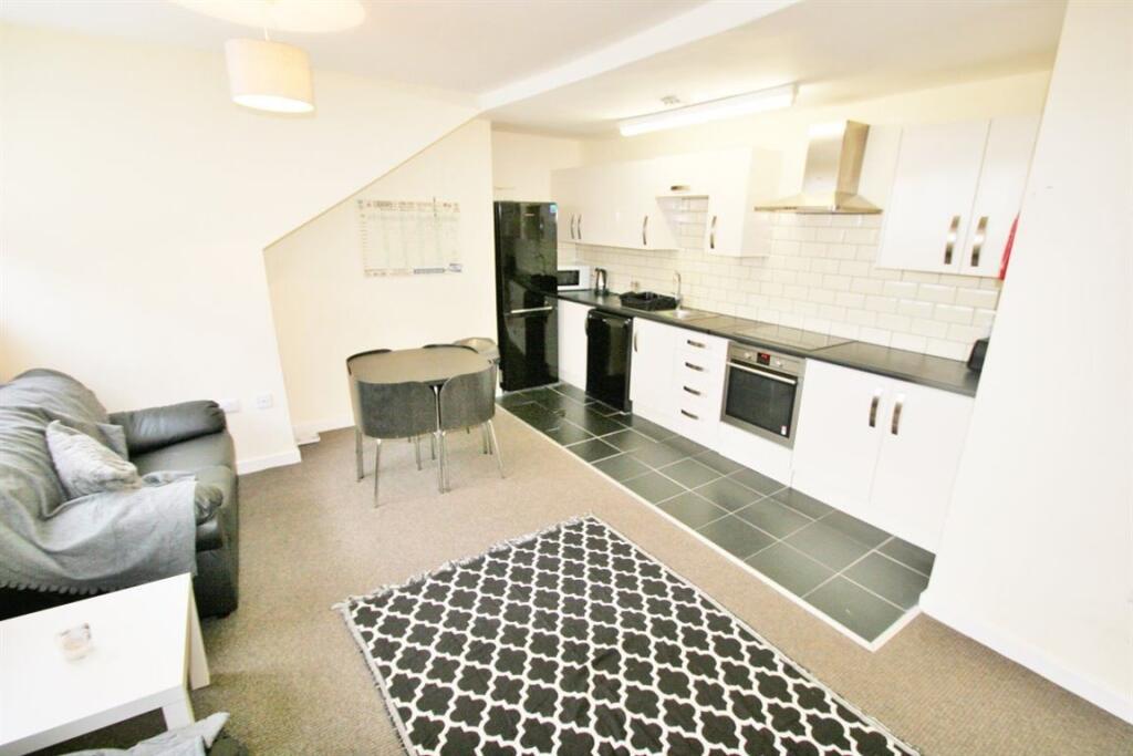 Modern kitchen with ample storage and a clean, ...