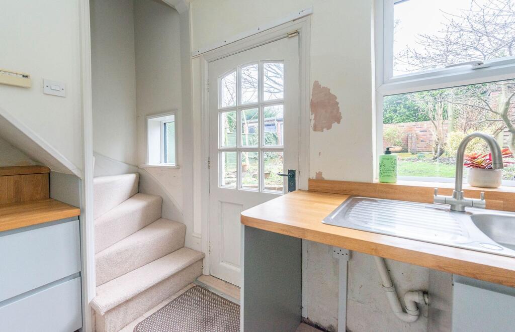 SITTING ROOM AND KITCHEN