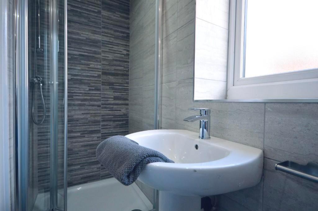 A modern and clean bathroom featuring a stylish...