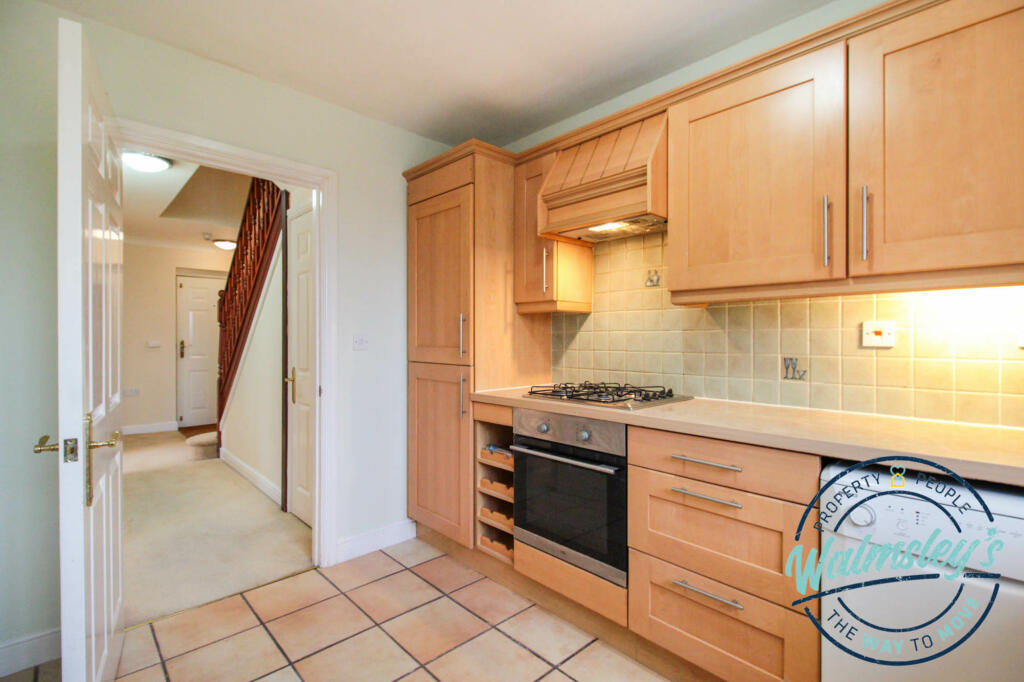 Kitchen with hallway beyond