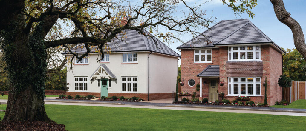Two modern detached houses with brick and white exteriors, surrounded by a well-kept garden and matu