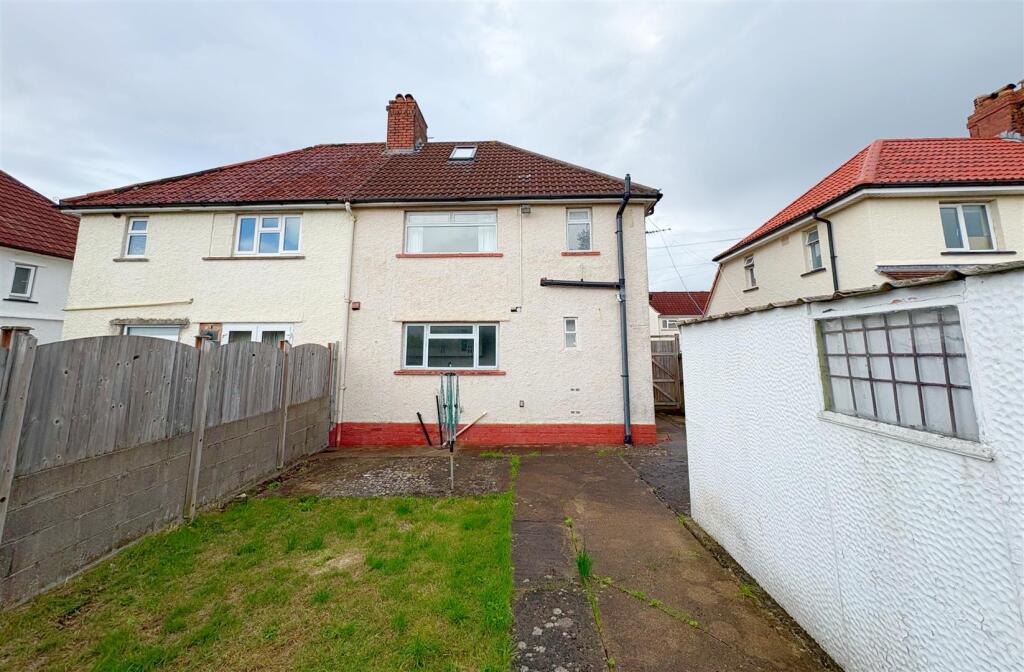 Rear view of property and patio.jpg