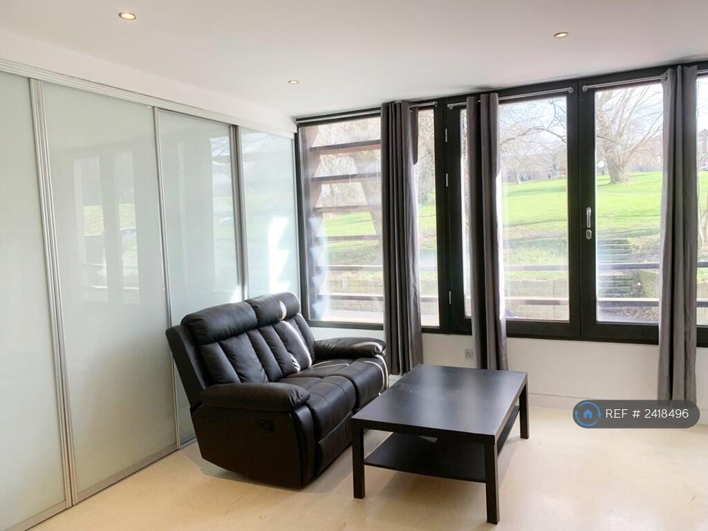 Living Room With Scenic Green Park Views
