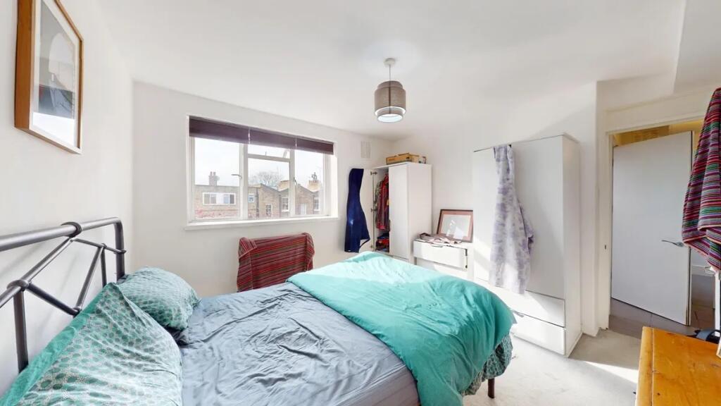 Bright and airy double bedroom featuring a larg...