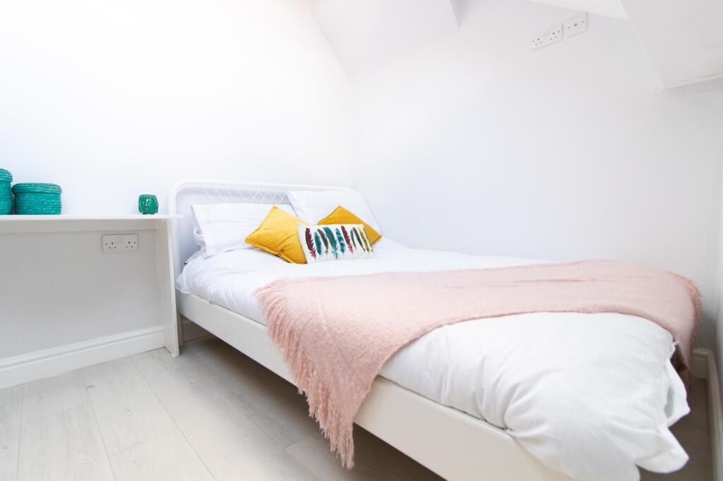 A bright and cozy double bedroom, perfect for s...