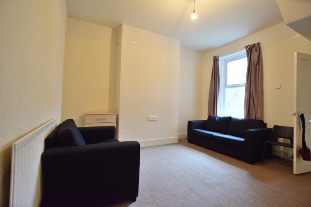 A spacious and inviting living room, perfect fo...