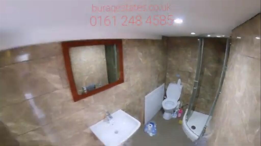 A modern, well-maintained bathroom featuring a ...