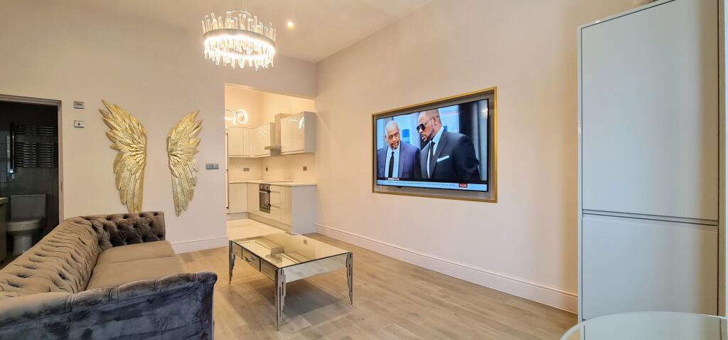 A modern and inviting living room featuring a c...