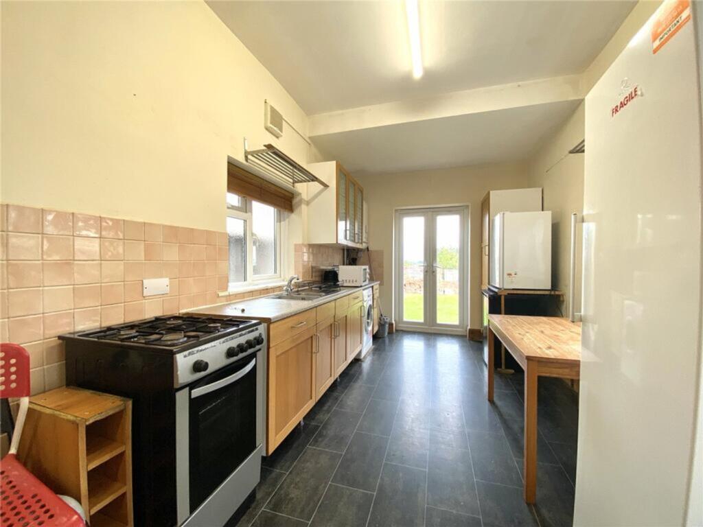 Spacious kitchen featuring ample counter space,...