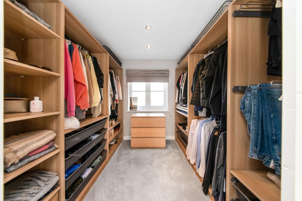 BEDROOM ONE WALK-IN WARDROBE