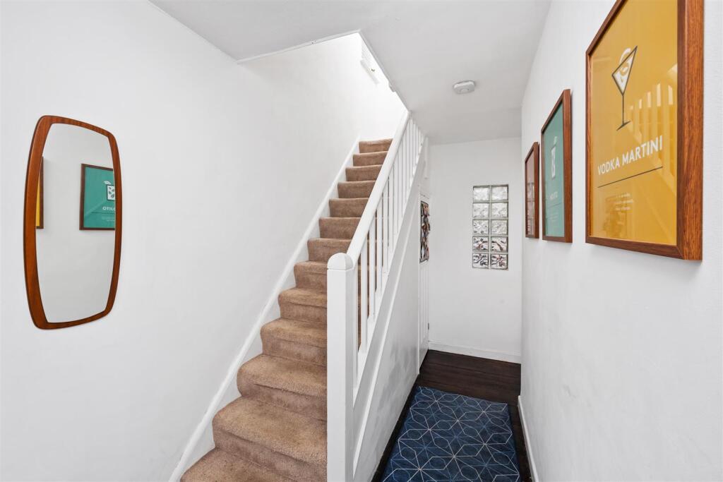 Stairs rising to First Floor