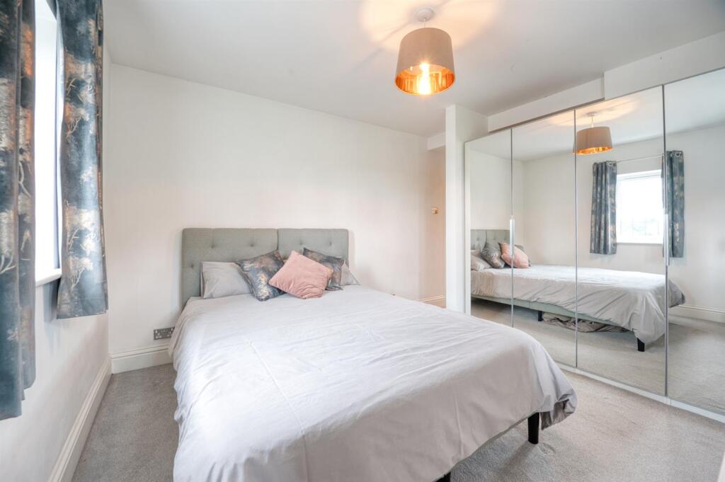 Bedroom Three to wardrobes.jpg