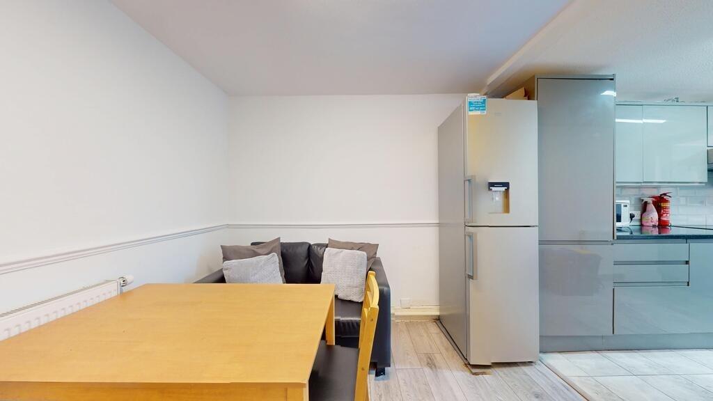 A modern kitchen with sleek grey cabinetry, a f...