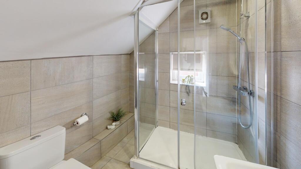 A modern and clean bathroom featuring a spaciou...