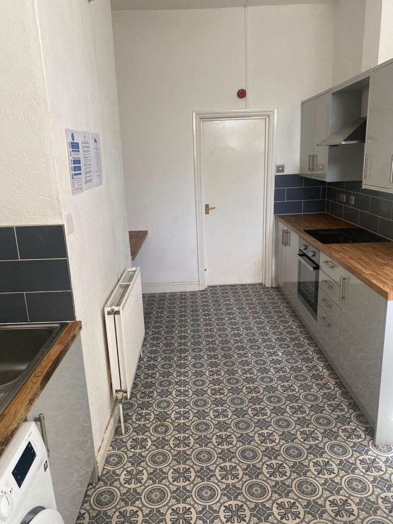 A practical and well-maintained kitchen with mo...