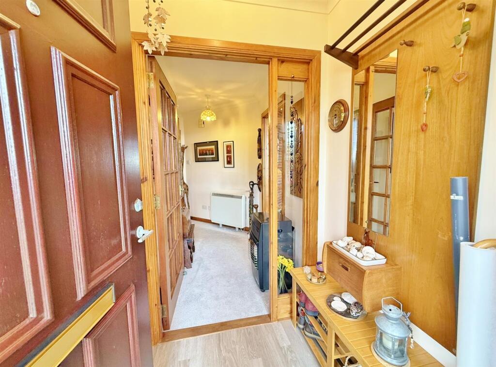Front entrance vestibule to hallway