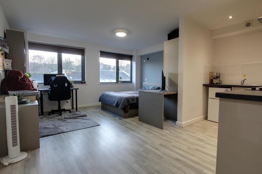 Open plan living room bedroom area and kitchen are