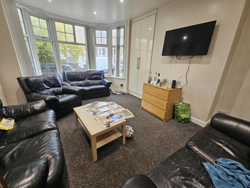 A spacious and inviting living room featuring c...