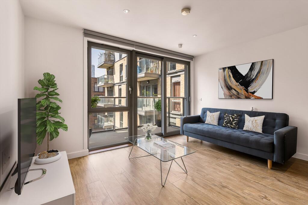 Experience contemporary comfort in this stylish urban living room, complete with elegant decor and inviting views.