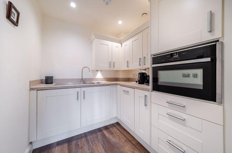Kitchen with built-in appliances