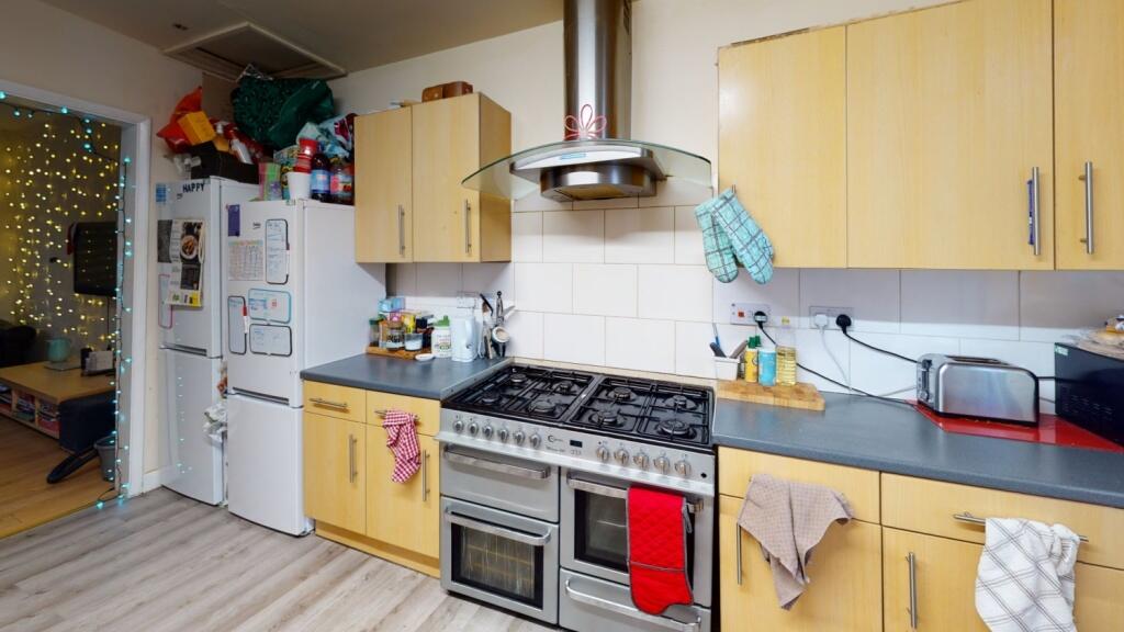 A bright and functional kitchen featuring ample...