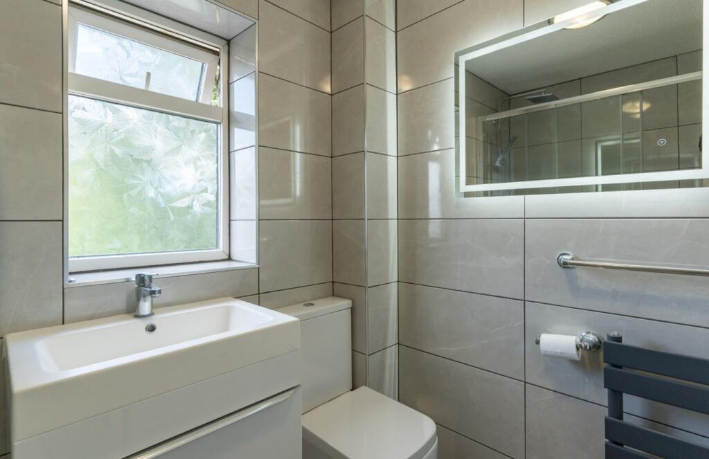 A modern and well-maintained bathroom featuring...