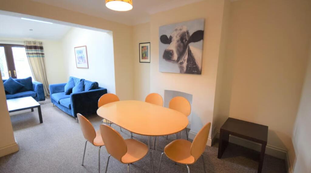 A cozy living room featuring a bright and invit...