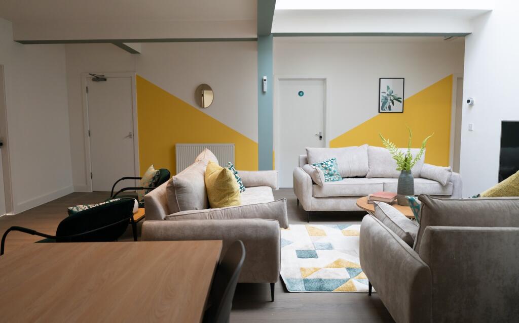 A spacious and stylish modern living room, perf...