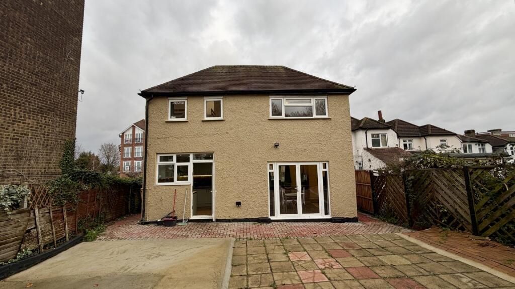 Clean two-storey house with a paved rear yard a...