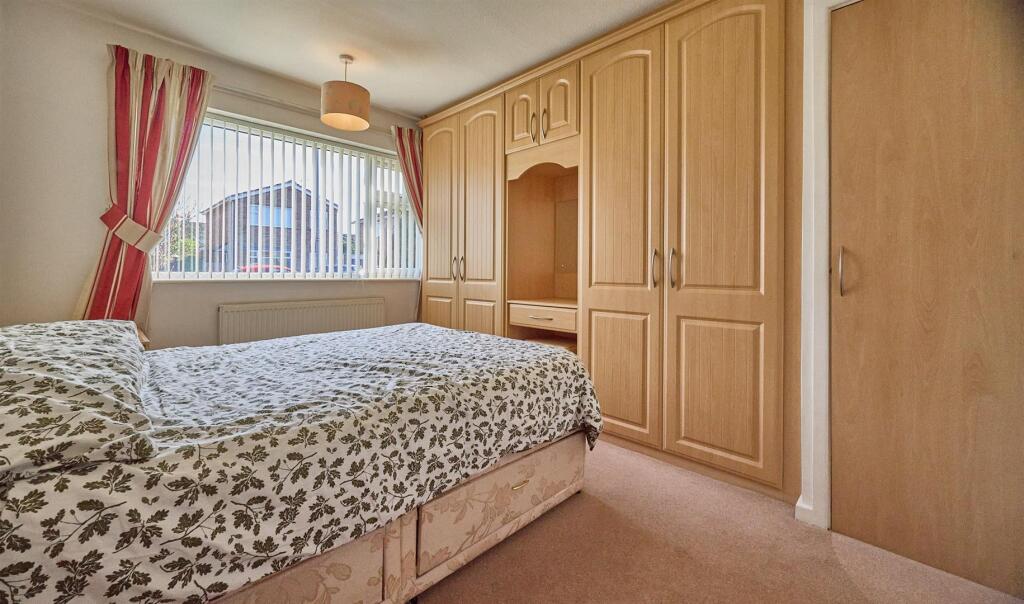 BEDROOM ONE TO FRONT