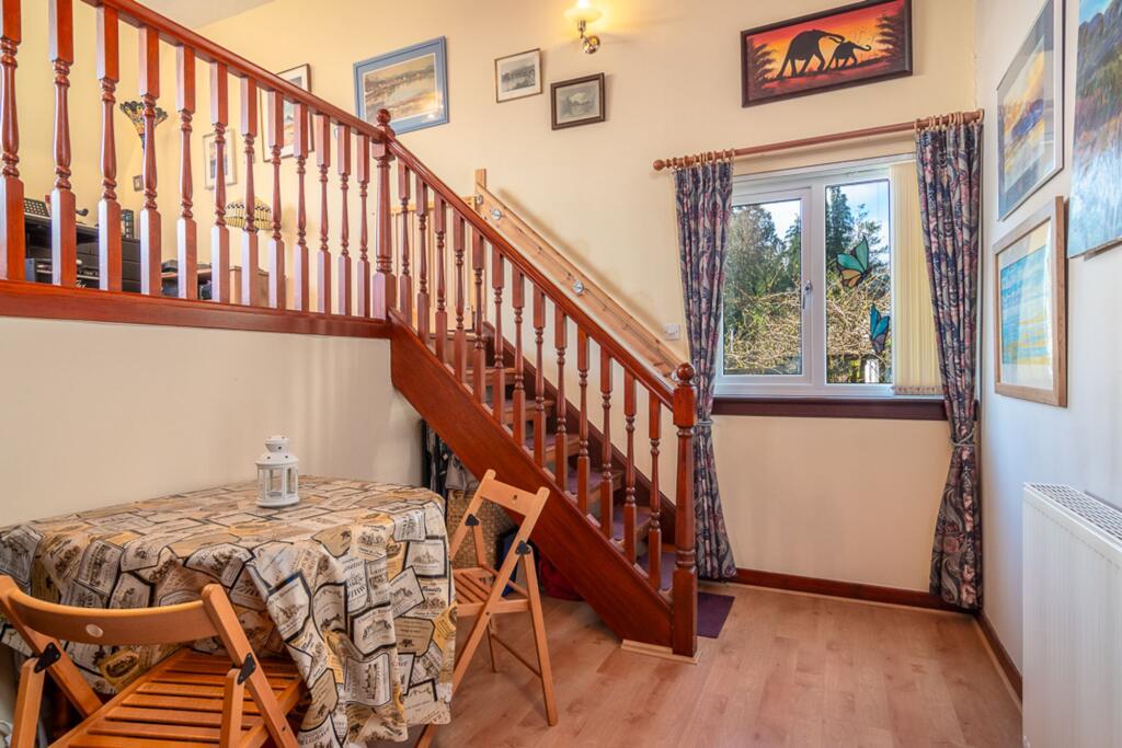Dining area and staircase to lounge