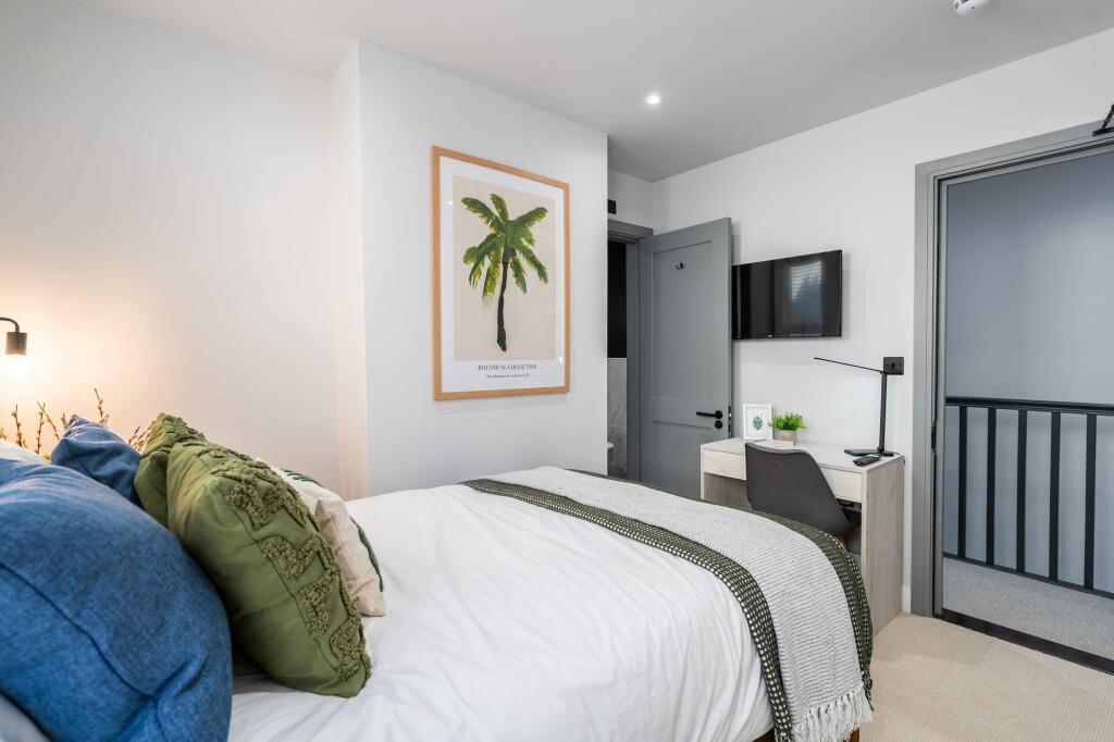 Bright and inviting master bedroom featuring a ...