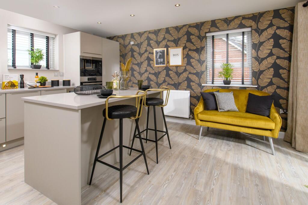 Alderney open plan kitchen with breakfast island and seating area