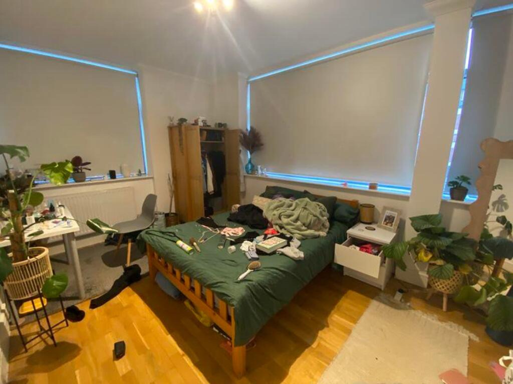 A cozy double bedroom with natural light, perfe...