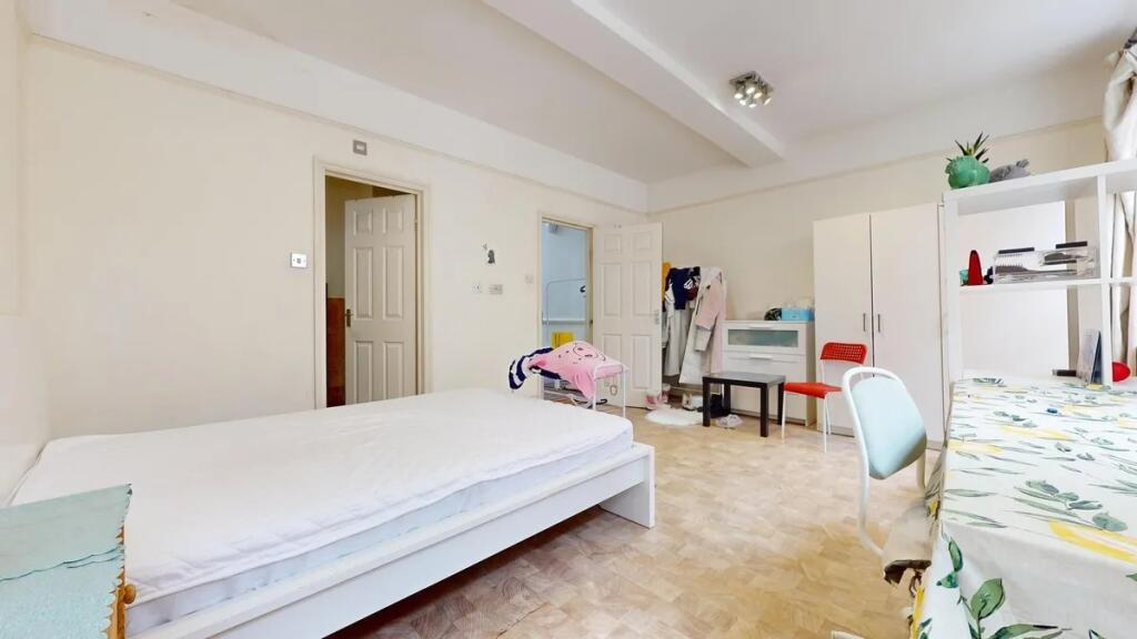 Bright and spacious master bedroom featuring a ...